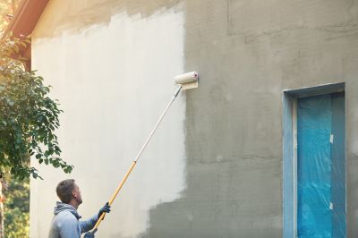 Handyman Painting a Wall